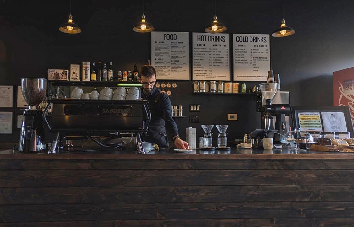 Coffee shop with someone making a coffee